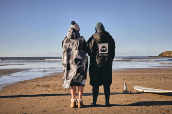 Surfing Gear for Different Seasons: What to Wear in Winter vs. Summer